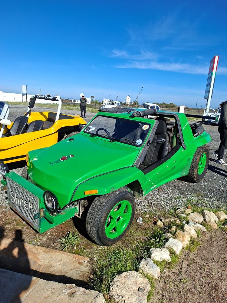 Anton’s green Kango beach buggy, Shrek, parked at a West Coast pitstop during the Wild Buggers West Coast cultural experience Run, showing off classic Beach Buggy style on the scenic route.