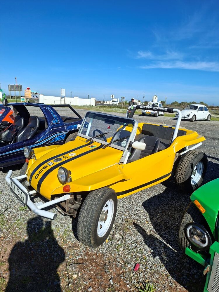 Wiehann’s yellow beach buggy parked at a West Coast pitstop during the Wild Buggers West Coast cultural experience Run, adding bright classic VW style to the scenic club convoy.