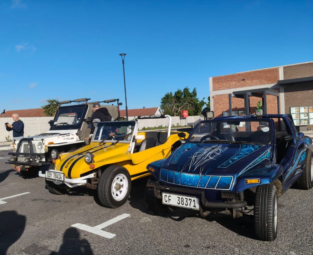 Three Wild Buggers vehicles parked at the Bothasig meeting point for the West Coast cultural experience Run: Faizal and Ayesha’s white Jeep with a Toyota motor, Wiehann’s yellow 1600 VW air-cooled Beamish Beach Buggy called Bugg, and Lerene Sadie’s blue Kango with a 1600 VW air-cooled Beetle motor.