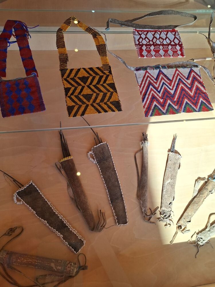 Another museum display cabinet at !Khwa ttu showing tools, objects, and everyday items used by San people during the Wild Buggers West Coast cultural experience Run, highlighting more of the historical exhibits at the San Heritage Centre.