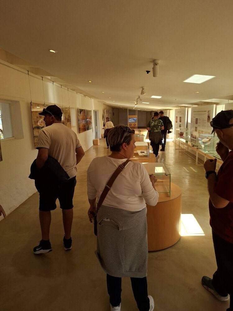 Wild Buggers members walking around and exploring one of the exhibition halls at !Khwa ttu during the West Coast cultural experience Run at the San Heritage Centre.