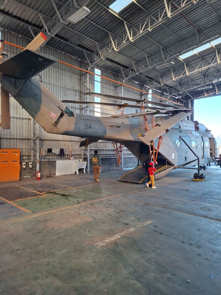 The rear loading ramp and exterior of a vintage Aérospatiale SA 321 Super Frelon troop carrier helicopter on display at the Ysterplaat museum during a classic car club run.