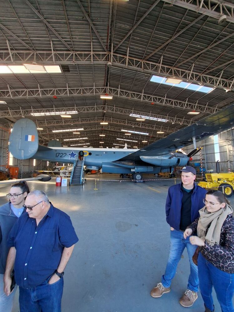 Wild Buggers club members checking out the massive Avro Shackleton maritime patrol aircraft inside the hangar at the South African Air Force Museum during a run for custom beach buggies, rugged Baja Bugs, and classic VW air-cooled vehicles.