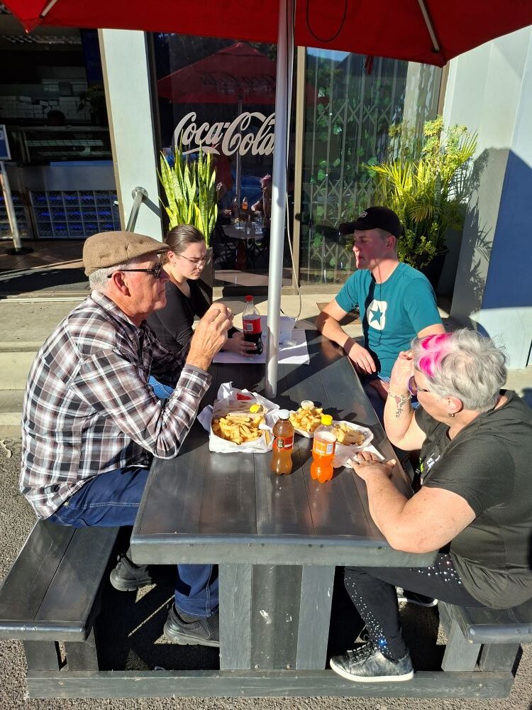 Club members enjoying a meal together at Cape to Rio Fisheries, a highlight of the Wild Buggers Beach Buggy Club Propellers and Pistons Winter Cruise featuring custom Beach Buggy, Baja Bug, and classic VW air-cooled vehicles.