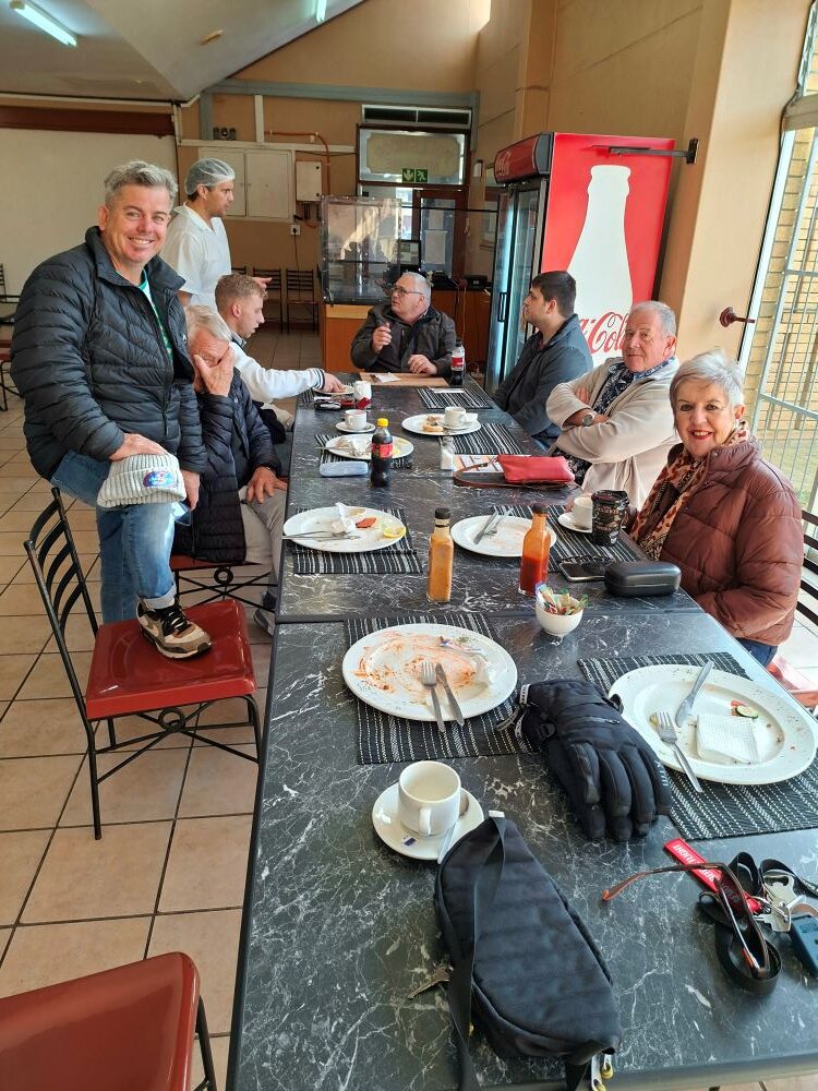 Club members enjoying a delicious brunch inside the Pollsmoor Menasie during the From Bars to Battleships run, surrounded by classic VW air-cooled enthusiasts.