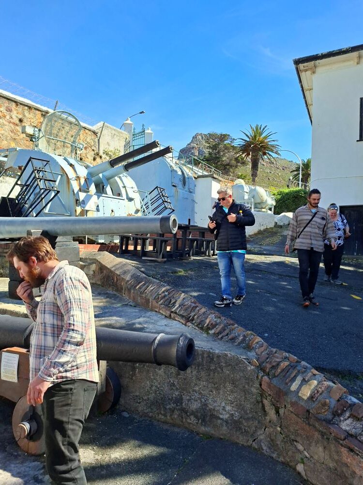 Wild Buggers club members exploring historic naval cannons on display right at the entrance of the South African Naval Museum in Simon's Town during our Western Cape club run.