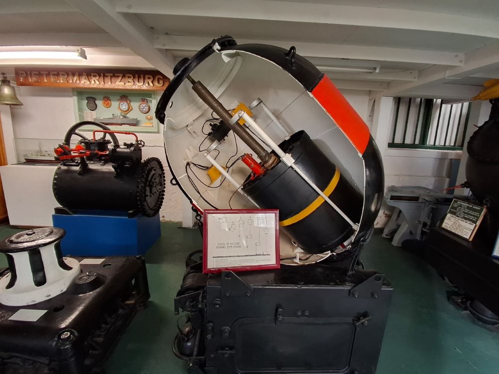 A cutaway display of a historical naval mine showing its internal components inside the museum.
