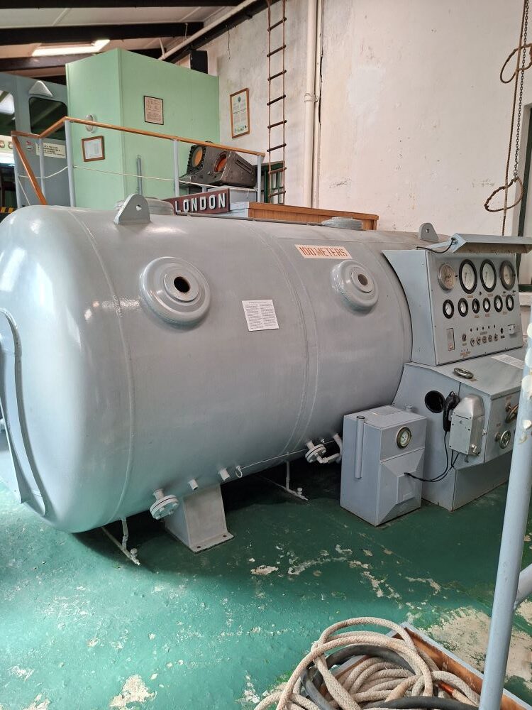 A historical naval recompression chamber on display inside the South African Naval Museum.
