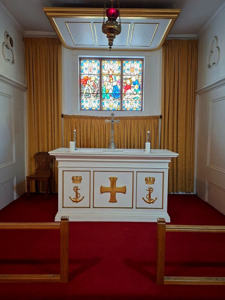 The altar and stained glass windows inside the historic naval church at Simon's Town.