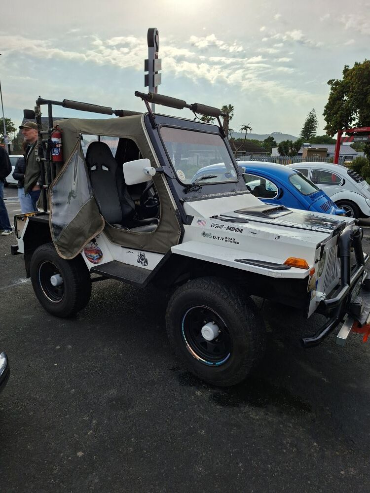 Faizal and Ayesha's white Jeep parked at the Bothasig meeting point before joining the club convoy.