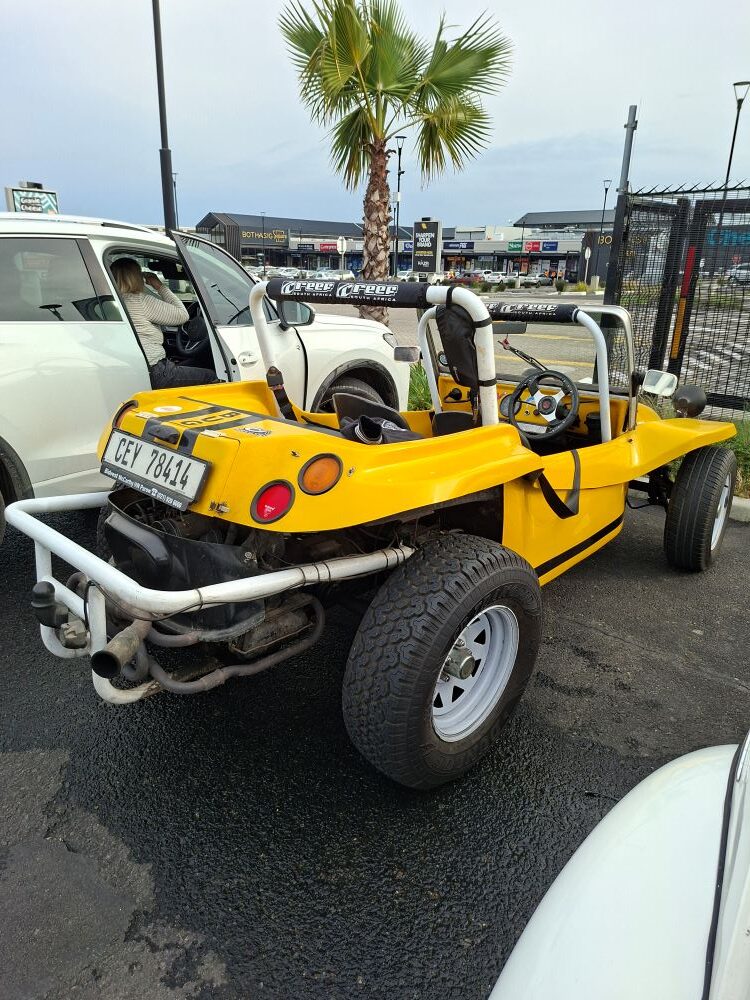 Wiehann Geldenhuys's yellow Beamish beach buggy named Bugg parked at the Bothasig meeting point.