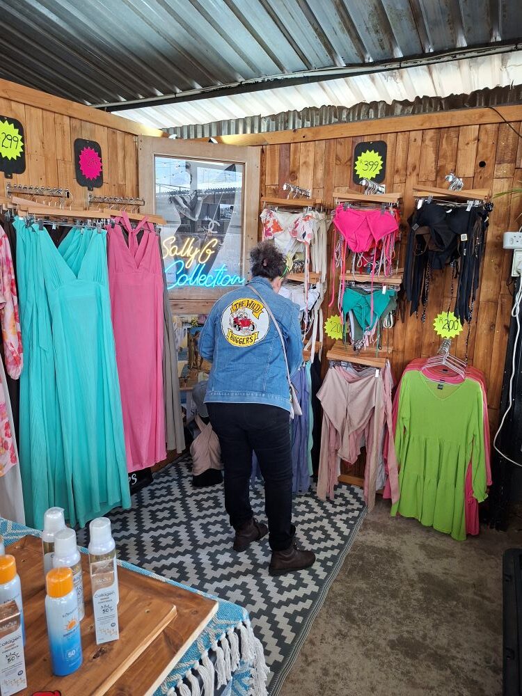 Mickey browsing a clothing stall during the club stop at Lourensford Market.